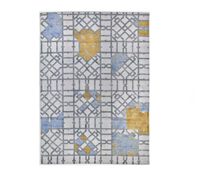 A modern design rug With an intriguing pattern design and a color palette of blue, yellow, and grey
